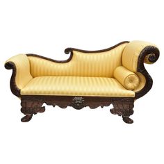 an ornately carved couch is shown against a white background with no one in it