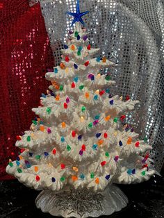 a white christmas tree with multi colored lights