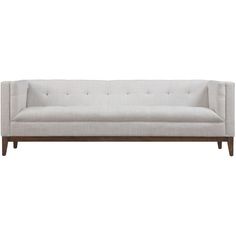 a white couch sitting on top of a wooden frame