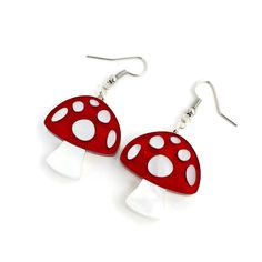 "Add some fun forest vibes to your wardrobe with these adorable mushroom earrings. The mushrooms are laser cut from red and white pearl acrylic making them visually stunning and lightweight. Mushroom charms measure 1.11\" tall and .956\" wide and hang from nickel free earring wires. Handmade in the USA. ★ ★ ★ Become a VIP and get 20% off your first purchase plus access to exclusive sales, sneak peeks and monthly giveaways. Copy and paste this link into your browser to sign up: bit.ly/levantervip Pinup Jewelry, Creepy Earrings, Forest Vibes, Red And White Mushroom, Alice In Wonderland Diy, Retro Mushroom, Cottagecore Earrings, Forest Jewelry, Mushroom Jewelry