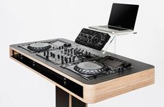 a dj's turntable with an electronic device attached to it