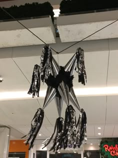 a star shaped decoration hanging from the ceiling