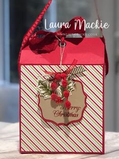 a red and white christmas bag on a table