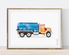 a watercolor painting of a blue dump truck on a white background, framed in a wooden frame