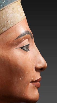 the head of an ancient egyptian statue is shown in this image, it appears to be painted