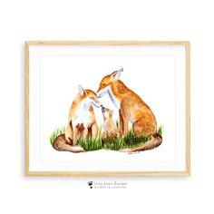 two foxes sitting in the grass with their tails curled up and looking at each other