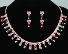 Luxury Look American Diamond CZ color stone necklace earring set in Rose-gold plating. Stone Necklace Designs, American Diamond Necklace Set, Green Statement Necklace, American Diamond Necklaces, Diamond Wedding Jewelry, Big Necklace, Diamond Necklace Set, Cz Jewelry, Pink Necklace