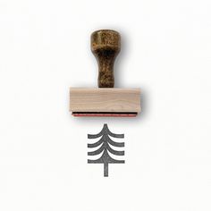 a rubber stamp with a pine tree on it