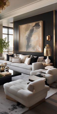 a living room filled with lots of white furniture and large paintings above the couches