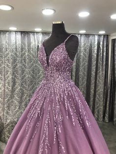 a purple ball gown with sequins on it