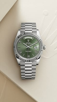 The Rolex Day-Date 40 in white gold, 40 mm case, olive green dial, a President bracelet. #Rolex #DayDate #OfficialRolexJeweler #AlsonJewelers Rolex Day Date Olive Green, Rolex Day Date Green Dial, Green Dial Watch Men, Green Rolex Watch, Rolex Green Face, Rolex Green Dial, Green Watch Men, Rolex Green, Green Dial Watch