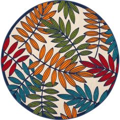 a round rug with colorful leaves on it