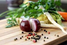 some vegetables are sitting on a cutting board