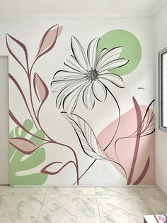 a room with a flower painted on the wall