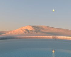 an empty swimming pool surrounded by snow covered mountains