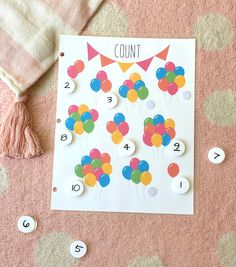 a counting game with balloons on it