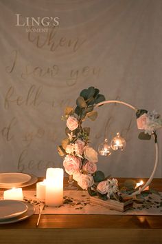 the table is set with candles and flowers