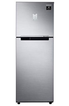 a silver refrigerator freezer sitting on top of a white wall