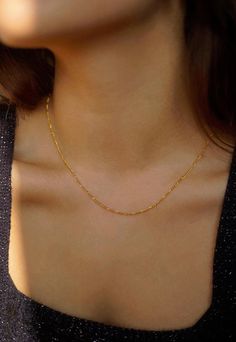 Model is wearing the 16-inch and 17-inch necklace. 14k Gold Filled Width - 1.5mm Extender - 1 inch If you would like a custom length, please don't hesitate to ask. We are more than happy to make one for you. All items come packaged in a gift box ready to give as a gift or keep for yourself. Gold-filled jewellery is a more affordable alternative to solid gold jewellery while still offering a similar appearance and durability. The thick layer of gold provides a long-lasting and tarnish-resistant finish so you can have pieces that will last. Our boxes are ECO friendly and FSC certified. FSC stands for Forest Stewardship Council® and is an international non-profit labelling system for wood and paper. The FSC mark guarantees that all materials come from an FSC forest, where no more wood is cut Everyday Gold Necklace, Fine Gold Necklace, Figaro Necklace, Delicate Gold Necklace, Necklace Gold Chain, Minimal Necklace, Coin Pendant Necklace, Dainty Gold Necklace, Necklace Layering