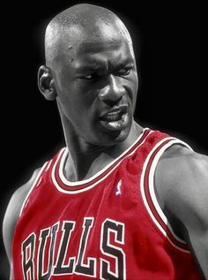 a close up of a basketball player wearing a red jersey with the word bulls on it