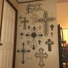 there are many crosses on the wall