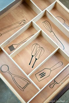 an open drawer with various kitchen utensils on it