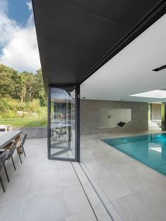 an empty swimming pool in the middle of a house