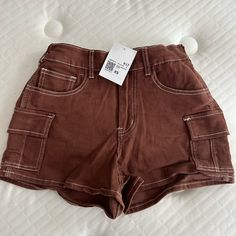 Brown New With Tags Shorts I Have 3 Of The Same Shorts In 2 Different Sizes So If U Like I Can See If I Have The Size U Need Trendy Brown Shorts, Casual High Waist Brown Shorts, Trendy Brown Jean Shorts For Spring, Trendy Cargo Shorts, Trendy Brown Shorts For Summer, Trendy Brown Summer Shorts, Trendy Brown Summer Bottoms, Trendy Forever 21 Bottoms With Pockets, Brown Cotton Cargo Shorts For Summer