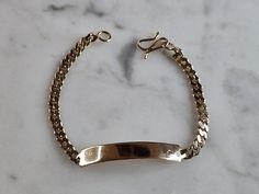 A WOMENS VINTAGE ESTATE 14K YELLOW GOLD ID BRACELET.  THE BRACELET MEASURES 5 3/8" LONG BY 1/4" AND WEIGHS 4.9g.   THE ID BAR MEASURES ABOUT 1 1/8" LONG.  BRACELET IS NOT STAMPED, BUT HAS BEEN TESTED AND IS GUARANTEED TO BE AS DESCRIBED.  THIS MAKES A GREAT GIFT FOR THAT SOMEONE SPECIAL.  BE SURE TO CHECK OUT SOME OF OUR OTHER GREAT ITEMS FOR SALE. Long Bracelet, Id Bracelets, Fine Jewelry Bracelets, New People, 14kt Gold, Chain Link Bracelet, Items For Sale, Link Bracelets, Arm Band