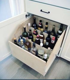 an open drawer with bottles in it