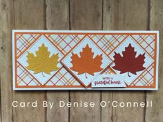 a card with three maple leaves on it