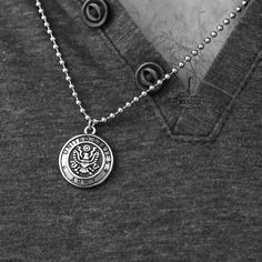 The United States Army Stainless Steel Polished Pendant on Ball Chain from our Military Collection is custom molded and cast with a premium blend of surgical stainless steel that offers durability for everyday wear. This unique military necklace features the words "United States Army" with a detailed eagle seal on each side of the necklace. This necklace can be worn as an everyday military necklace or can create a subtle but meaningful accent to a dressier look. Express your support for the US A Stainless Steel Pendant Jewelry For Streetwear, Stainless Steel Pendant Necklace With Compass Design, Metal Dog Tag Chain Necklace, Military Necklace, Necklace Aesthetic, Dog Tags Military, Biker Jewelry, Ball Chain Necklace, Stainless Steel Polish