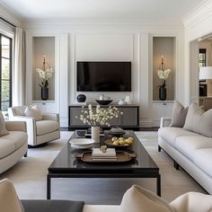 a living room filled with furniture and a flat screen tv