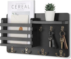 a black shelf with keys and key holders on it