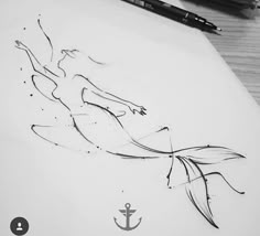 a drawing of a mermaid with an anchor on it