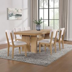 Modern Elegance with the Dahlia Dining SetThe Dahlia Seven-Piece Dining Set is a perfect blend of sleek lines and modern elegance, offering a simple yet sophisticated silhouette. The centerpiece is a beautifully crafted table with a poplar-veneered top and a bold split-slab leg design that exudes a modern, organic look. This set effortlessly transforms your dining area with its refined design and quality craftsmanship.Comfortable and Stylish Dining ChairsAccompanying the table are six dining chairs that feature matching wood bases and split-back designs. These elements contribute to enhancing the natural feel of your space. The chairs are not just aesthetically pleasing, but also highly functional with performance fabric upholstery that is both stain and liquid-resistant. This ensures dura Scandinavian Kitchen Table, Light Oak Dining Table, Modern Farmhouse Dining Table, Dining Table With Chairs, White Oak Table, Large Dining Room Table, Dining Room Table Sets, Modern Dining Table Set, Black Chairs