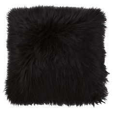 a black furry pillow on a white background