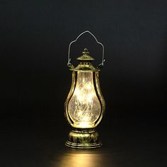 an old fashioned lantern lit up in the dark