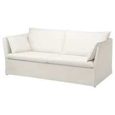 a white couch with two pillows on it