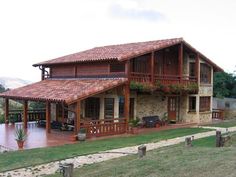 a large house with a wooden deck and covered patio