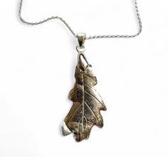 Solid Silver Oak Leaf Necklace - Made With A REAL Oak Leaf   This is a TOTALLY unique piece of silver leaf jewellery. Rather than just being a mold or cast - reproduced OVER AND OVER AGAIN, this                          necklace is intricately made from a real leaf. I chose a nicely shaped leaf from my local park, and with a complex process that                          takes nearly 2 weeks I have coated the leaf in 10 coats of a special silver clay called                              PMC. This Leaf Jewellery, Oak Leaf Necklace, Real Leaf, Silver Oak, Silver Clay, Real Leaves, Leaf Jewelry, Oak Leaf, Leaf Necklace