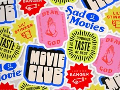 various stickers that say movie club and are all over the place in front of each other