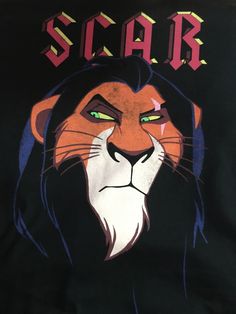 a black shirt with the word scar on it and a lion's head in front