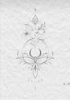 the back side of a white paper with flowers on it and an ornamental design in the middle