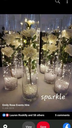 flowers are in vases with lights on the top and bottom for sale at sparkle