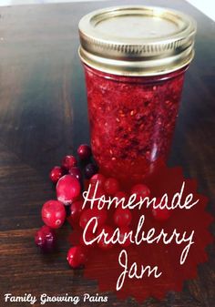 the best cranberry jam recipe in a jar with berries on top and text overlay that reads, the best cranberry jam recipe