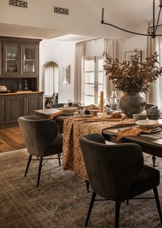 the dining room table is set with place settings