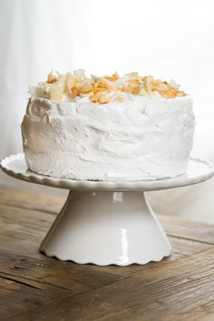 a white cake sitting on top of a wooden table