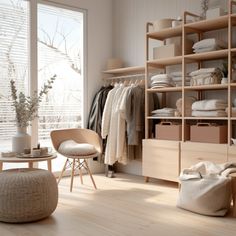 an open closet with clothes and other items on shelves, in front of a large window