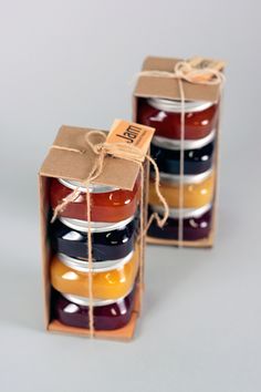 two boxes with jams in them are tied up and ready to be packaged into the package